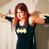 Bound latex bat girl
